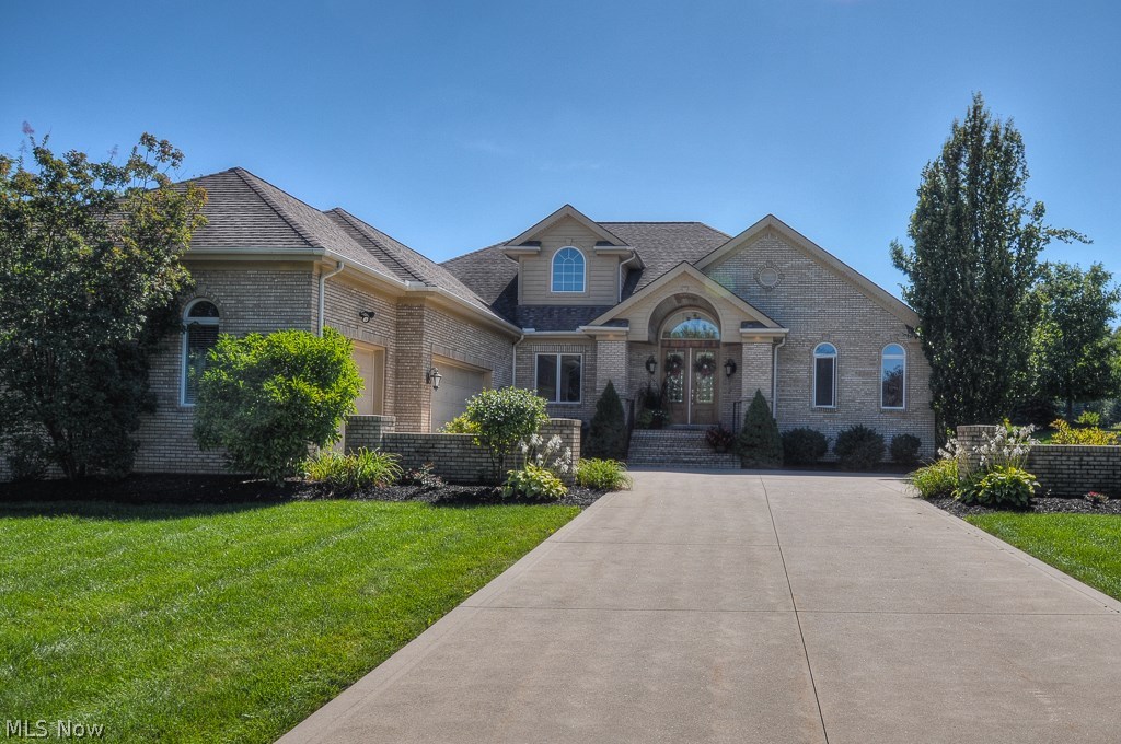 3 bedroom, 3 full, 2 half bath, all brick ranch in Barrington Estates gated golf community. Located on a quiet cul-de-sac, this home features a 1st floor owner's suite with tray ceiling & luxurious master bath. 2 story foyer leads to formal living room. Dining room w/tray ceiling. Curved staircase leads to large loft in upper level complete w/dry bar, wine fridge & half bath. Gourmet kitchen w/stainless appliances, granite countertops & maple cabinets & is open to family/hearth room w/stone fireplace & numerous windows. 2 additional bedrooms on 1st floor w/full bathrooms & walk-in closets. 3000 additional sq. ft. in basement w/38x26 workout area. 3 car garage plus beautiful courtyard patio complete this home.