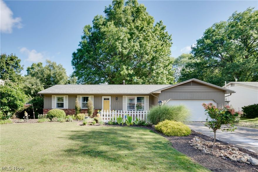 Welcome to 425 Green Meadow Drive - Beautiful 3 bedroom Ranch home in desirable Tallmadge neighborhood! As you enter the foyer you are greeted by a  Formal living room that is full of charm and character. The Spacious Eat-In Kitchen is newly updated and features lots of cabinet space, tile backsplash, pantry and appliances that stay! The Kitchen is open to Family Room that has sliding doors which lead to Cozy sunroom that is great to relax and unwind. Full bathroom was just updated with a subway tile surround, fresh paint and accessories. Nice size Master bedroom with stylish 1/2 bath and double closets plus two additional bedrooms finish off the first floor. Partially finished basement adds extra living space. 2 car attached garage. Great curb appeal w/ beautiful landscaping. You don't want to miss this one!