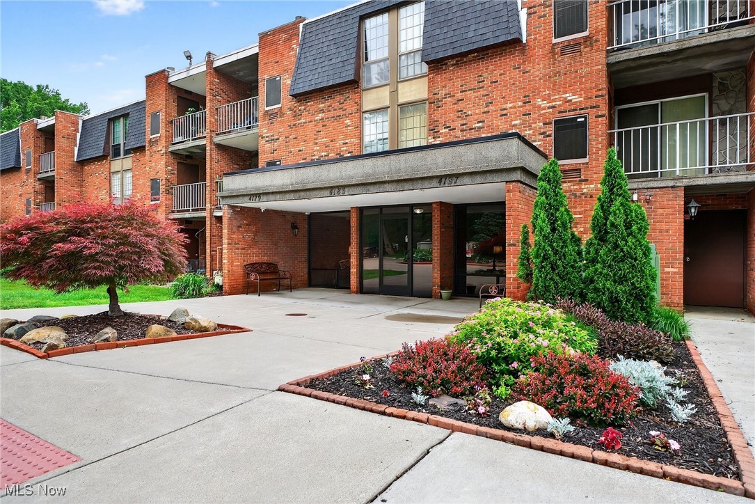 Privately situated in a park-inspired landscape is Olmsted Park's ONLY CURRENT LISTING: a highly desirable, ground-level Suite 122, ripe with costly upgrades, tasteful finishes, and truly move-in ready! The long list of improvements and features of this unit are HIGHLY DESIRABLE: In Suite Laundry in an expansive flex room off the kitchen which houses a Maytag stackable unit AND plenty of shelving for surplus storage; 2 Updated Bathrooms, one of which is the private en-suite to the Primary Bedroom; 2 reserved indoor parking spaces (1 deeded, 1 rented) affording year-round protection of your motorcars; a spacious, inviting Lobby to receive guests; a pet-friendly building where Fifi & Fido are welcome; and a recreational oasis with the swimming pool in the rear grounds. The expansive eat-in Kitchen showcases a complete remodel, donning an abundance of whisper-close tongue & groove white cabinetry, a coordinating subway tile backsplash, and a dramatically contrasting granite counter that is generously sized for all your culinary exploits! A coordinating white appliance package, featuring new Microwave and gas stove, convey with the property. Enjoy new and tasteful LVP flooring in most common areas and plush carpeting in the Bedrooms. Both full bathrooms feature oversized and updated wood vanities with tongue-and-groove construction and ample storage, oversized countertops and wall vanities that will enable picture-perfect organization. The guest bathroom has been updated with a walk-in shower, and the ensuite bath retains the original bathtub; both lavatories finely offer the original ceramic flooring, perfectly intact and tastefully neutral. Lifetime-warrantied Moen plumbing fully outfit this unit. Sliders to the west-facing patio face the front grounds and the Edenic flowerbed that graces the main entry. Reasonable maintenance fee. Central location near highways, shopping, eateries, the Metroparks, and more! NO LEASING. Current taxes feature HOMESTEAD EXEMPTION.