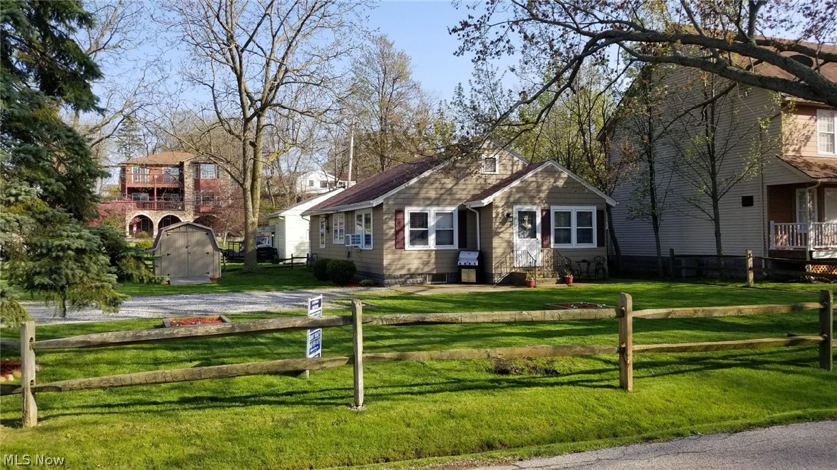 Don't miss a great opportunity on this ideal home. Just reduced, motivated seller. Enjoy this summer retreat on an extra wide 74' corner lot near Lake Erie! Beautiful sunsets and lake breezes during the summer. Small, close-knit and quiet neighborhood. Enjoy annual parties and holiday events with the neighborhood! Home has been remodeled and updated throughout. Ceramic tile flooring and tub surround in the bathroom. Laminate and vinyl flooring throughout the rest of the house except for the third bedroom/office. Dedicated stairway to attic for possible expansion or storage. Home is perfect for the first buyer or a summer retreat for the boater or fisherman. Close to shopping and Rt. 2/90 to downtown Cleveland. Private access to beach, playground, yacht club and clubhouse! All appliances and new window-AC unit stays!!