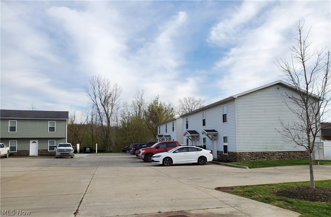 Great investment opportunity located right off I 70 in Cambridge, Ohio. These FULLY furnished town homes are currently 100% occupied and ready to make you some money. These newer, well maintained 15 units are located on approximately 2 acres with 2 parking spaces per unit, a basketball hoop and great back patio space. There is room to build additional units for even more income. Currently there is 1- 1 bedroom 1.5 bathroom unit, 6- 2 bedroom 1.5 units, and 8- 2 bedroom 2.5 bathroom units. Owner currently pays all utilities including trash, electric, cable, gas and water. Each unit is fully furnished, as well as contains all appliances including washer and dryers and even cookware, dishes and silverware. Tenants can move in quick and easy with no worries about furnishing or utility transfer. Averages rents are approximately $1300 per month for full financials are available for pre-qualified buyers.