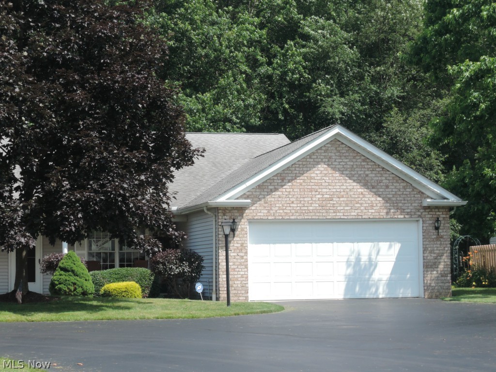 The condo association everyone wants...up against Mill Creek Park! Nice ranch with 2 large bedrooms, 2 full baths. Large living room and dining room. Concrete patio off the kitchen with an electric SunSetter shade...awesome! 2 car attached garage with a drain, hot and cold water and built in cabinets for storage. Security system! Amazing views...all appliances stay.