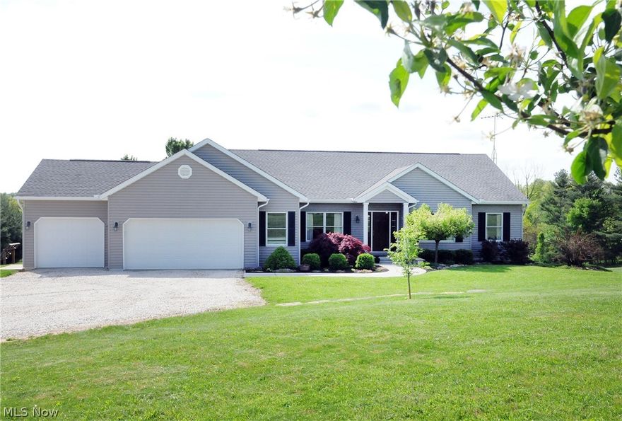It isn't often that a superb single story home with a 3-car attached garage, on a gorgeous country setting of 6 acres, on a paved road, comes on the market but today is your lucky day! Sitting quietly down the driveway you'll be greeted with lush landscaping framing the entry to this well-cared for residence. Inside you'll love the open floor plan and high ceilings that offer both convenience and style. The spacious kitchen shows off plenty of counter space with gorgeous oak cabinets plus additional space with the island breakfast bar. The laundry room is conveniently located between the garage and kitchen. The Master suite offers more than enough room for your king-size bed and a master bath with garden tub and separate shower. The sliding glass doors from the dining area lead to a pillared back porch and a delightful dining patio that overlooks a lush, park-like yard. You will picnic in the park in your own backyard. Call now to make this amazing home yours. The security system is a