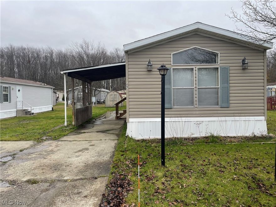 Fresh paint, updated cabinets, and updated flooring throughout this 3 bedroom, 2 bathroom mobile/modular style home, all that's left to do is move in! Lot rent is $450, and any potential buyer must be approved by the park management.