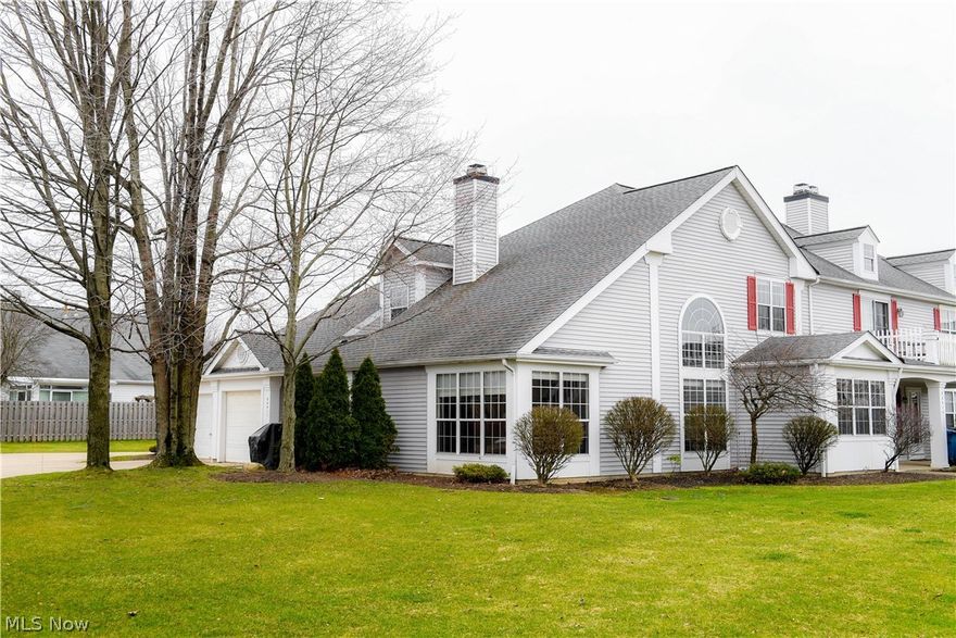 You will be impressed as soon as you enter this 1,799 sq ft townhouse. Location is key in this end unit adjacent to a large green space and additional parking.. The Great room reveals a 2 story ceiling, wall of windows, hardwood floors and fireplace. Kitchen has tiles floors, white cabinets, plenty of cabinet space and a sunlit dining area. The first floor master bedroom reveals new carpet, walk in closet and access to the extra large main floor bath with double sinks. First floor laundry.  Second floor has spacious 2nd bedroom and loft that overlooks the great room. The loft can easily be finished if a 3rd bedroom is needed. New carpet in the upstairs as well along with an additional full bath. This fabulous townhouse has been freshly painted and meticulously maintained. Located close to the airport, short drive to downtown Cleveland. Home warranty included.