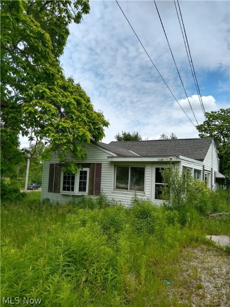 Two acre lot with 257' road frontage on Madison Rd., past Chardon Windsor.  Nice location with many possibilities. Driveway in place and electric at the pole. There are two existing homes on the property that have not been occupied since 2015.  Per Seller the one bedroom home is on a basement and may be salvageable; the main home is on piers.  Priced below assessed value. "AS IS, WHERE IS."