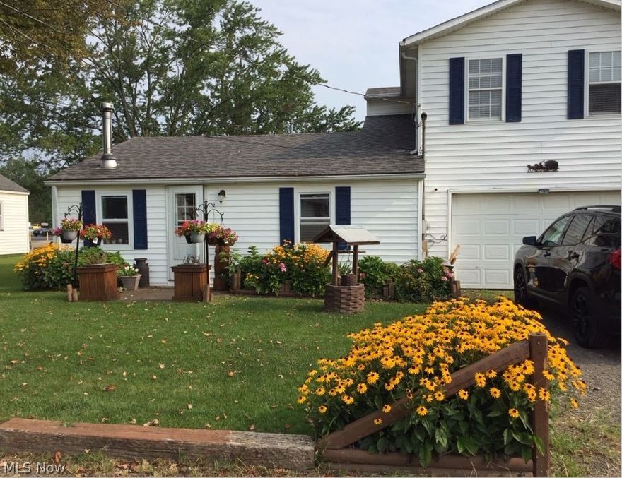 This cozy, well kept home has many updates and is move in ready awaiting your personal touches! Located on a quiet street with a beautiful fenced in backyard that has a deck as well as an additional detached garage with wood burning stove for extra entertainment/storage space with alley way access. 3 bedrooms upstairs have all been newly renovated and a bonus room downstairs.  Furnace 2017, Hot Water Tank 2015, Vinyl windows, and detailed woodwork throughout.  All window fixtures stay as well as refrigerator, microwave and range. Detached Island does not stay.