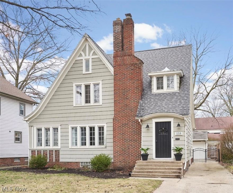 Warm and Character filled Tudor style Colonial in West Akron featuring 3 bedrooms, 1 1/2 baths and 1769 sq ft. Inviting first floor offers Living Room with fireplace, Sunroom/Office, Dining Room, 1/2 bath and Large Eat in Kitchen.  You'll find the three bedrooms upstairs along with the main bath and don't miss the bonus space in the attic!  Hardwood floors throughout. Fully fenced backyard with patio and 2.5 car garage.  New A/C 2024. Gutters on back 2024.  Agent Owned.