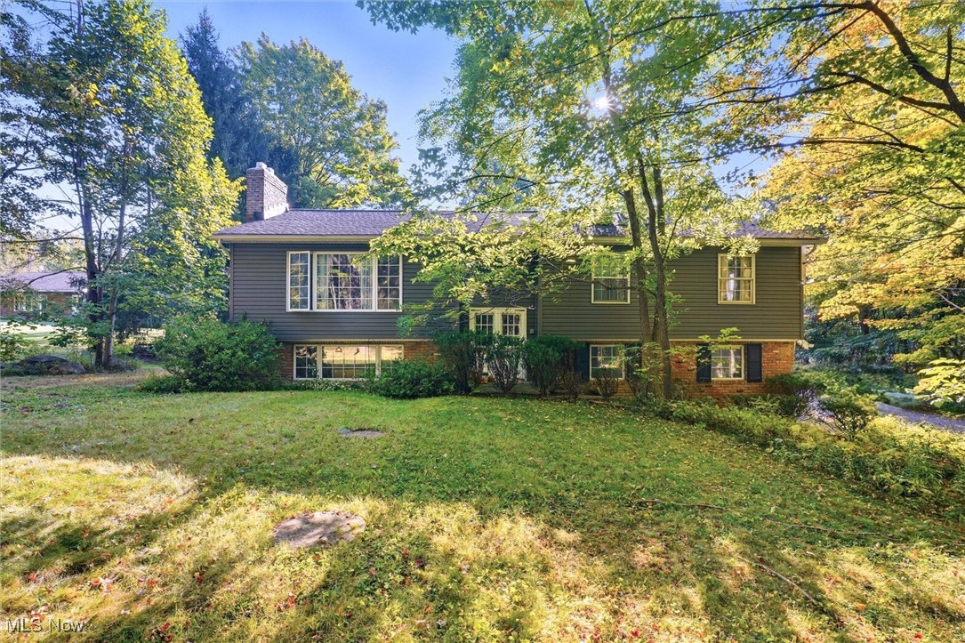 Beautifully Updated Home on 1.7 Scenic Acres in Newbury! This meticulously maintained 4-bedroom, 3-bath residence offers the perfect blend of comfort, style, and versatility on a picturesque setting. Recent improvements include new vinyl siding, a newer roof, an upgraded HVAC system, a remodeled bathroom with a custom ceramic tile shower, and gleaming hardwood floors throughout. The newly updated kitchen features granite countertops, modern vinyl flooring, and a charming kitchenette. The spacious living room with a wood-burning fireplace flows seamlessly into the dining room—ideal for gatherings and everyday living.The lower-level family room provides an inviting space to entertain, complete with a second fireplace, an office or optional bedroom, and a full bathroom. Step outside to enjoy the beauty of nature from the open deck overlooking the serene backyard. Additional features include a heated garage, gas generator hookup, and a massive outbuilding with a 12-foot door—perfect for RV or boat storage, a workshop, or hobbies of all kinds. Whether you’re a growing family, hobbyist, or simply looking for space to spread out, this rare Newbury gem is ready to welcome you home. A 1-Year Home Warranty is included for added peace of mind
