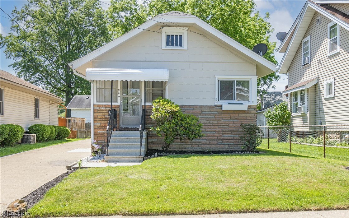 Welcome home to 844 Wyley Avenue! Don't miss this cozy two bedroom, one bathroom bungalow boasting updates throughout! Enter through a screened in porch to your main level featuring new carpet and luxury vinyl flooring. A spacious living room and nearby dining room flow nicely into a beautiful kitchen complete with newer countertops and stainless steel appliances. Down the hall you will find a full bathroom along with two great sized bedrooms, one with an additional sitting area/closet space. The lower level offers ample storage and a laundry area with new washer and dryer. Enjoy your evenings in the private fenced-in backyard. Additional notable updates include: new paint throughout, plumbing, and HWT. Schedule your private viewing today!