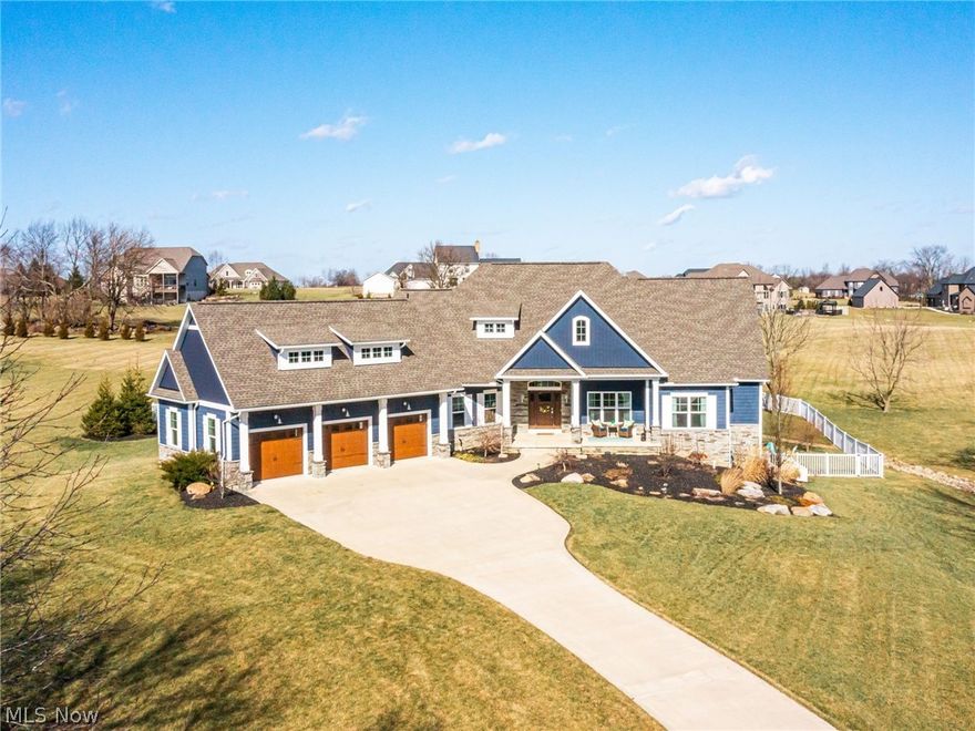 This exquisite 4 BR, 4 ba ranch sits on over 2 acres and is everything you have been looking for! As you enter, a formal DR is off to your right w/ a private office to your left. Directly ahead is the great rm w/custom built-ins & double sliding glass doors leading out to the covered composite deck w/floor to ceiling stone fireplace! The architecturally stunning  kitchen offers custom white cabinetry, granite counters, beverage station+ huge center island. The owners retreat is off a private hall +offers a spacious bathroom w/sleek freestanding tub, double vanities+ceramic shower. This level is completed w 2 other bedrooms connected by a jack-n-Jill full bath, laundry rm, powder rm & mudroom. The finished lower level walks out to an entertaining patio+ features a large rec room, bar w/ stainless appliances and 4th BR w/ full bathroom. A large second patio, lush landscaping w/stone accents and 3 car garage round out this MUST SEE home.