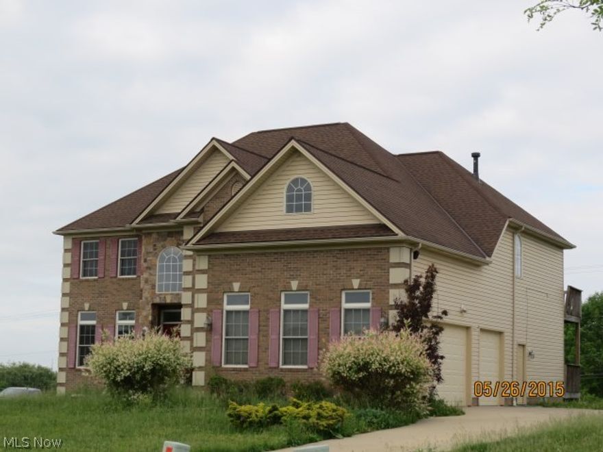 Sold As is.  Come and enjoy this great home with wood cabinets in the kitchen.  The front door entry with hardwood floors and vaulted ceiling.  The Master bedrooms has a grand Master bath with gas fireplace.  The basement is a walkout with a roughed in bathroom.  Close to all amenities.