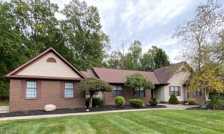 This large fully remodeled like new Ranch has a beautiful modern Kitchen with granite countertops, tile backsplash and bamboo wood floors through out. With its open concept floor plan, a great room with vaulted ceilings, a spacious breakfast area, and a formal dinning room as well. As you walk in from the garage to a mud space with locker bench, 1/2 bath on one side and the convenience of a laundry room to the other side. A large office with french doors, 2.5 bathrooms, the 2 fulls both have double sinks, a 3 car garage, large walk in closet in the master, a fully screened in porch, a deck, and a full basement. All on a scenic 1.03 acre wooded lot in a premium development. This home is truly a must see!