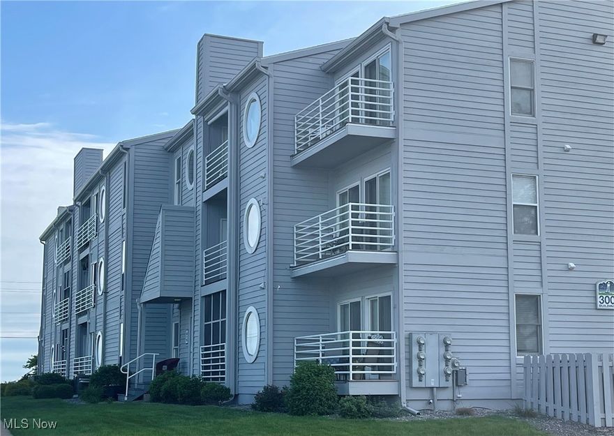 Enjoy stunning Lake Erie views from this first-floor, 2-bedroom, 2-bath condo, complete with a 30-ft dock slip, pool, hot tub, clubhouse with grilling area, and fire pit for ultimate relaxation! The spacious living room and dining area flow seamlessly into the kitchen, featuring bar seating and included appliances. A convenient laundry room is just off the kitchen. The owner's suite boasts an attached full bath and a walk-in closet. Step outside onto the covered deck, accessible from the master bedroom or living room. The second bedroom, located next to a full bath, also has a walk-in closet for plenty of storage. Bask in the sunlight streaming through the patio doors, while enjoying views of Lake Erie and the marina along the Portage River. You're just a short distance from the Jet Express and downtown Port Clinton!