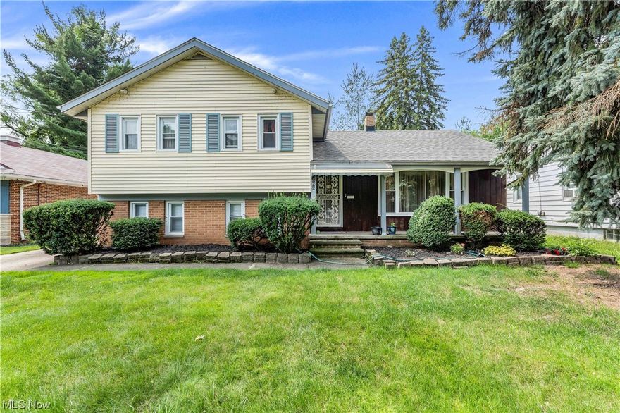 This beautiful single-family split-level home has so much to offer! You are welcomed with a large front porch and flower beds stretching across the front of the home! Walk into the open living room featuring gorgeous hardwood floors, vaulted ceilings and huge windows that allow for tons of natural light! Continue into the large kitchen with cabinets that wrap around the room and tons of counter space! Connecting to the kitchen you will find an open dining area also featuring hardwood flooring! The dining area feature sliding doors that lead out to an additional room that can be used as a recroom, playroom or additional living space! Off of the living room, walk down to a large bedroom and additional living space along with a convenient full bath featuring a tiled shower! Continue down to the basement that has plenty of room for storage and a laundry area!  Upstairs you will find 3 large bedrooms with closet space and a full bathroom that features a walk-in tub! The master bedroom is complete with an attached half bathroom! Outside you will find a large driveway leading to the huge backyard and attached 2 car garage! With easy access to highways and near shopping, food and public transit, this won't last long! Schedule a showing to see it for yourself!