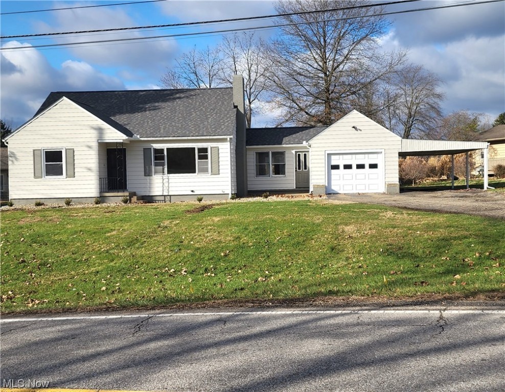 Updated Qne and a Half Story Cape Code with Garage and CarPort, Paved Drive, Spacious Main Floor Family Room with a wall of Built Ins, Plus Great View of Rear Yard, Updated Kitchen with Stone Counter Tops, All New Appliances, and new Flooring open to Kitchen, Living Room with FirePlace and Original Hardwood Floors, Main floor contains 2 Full Baths Plus 2 bedrooms all newly Painted and Carpeted, Second Level has a Super Sized Cozy Bedroom with 2 Large Storage Closets, An Enclosed Breezeway Could coube as an Office or Den. Exterior has a New Room and has all the Material to fence the rear Yard for Pets or Contain all the Backyard Activities, Home has Been Completely gone over to Make it in MOVE IN CONDITION for the New Year !