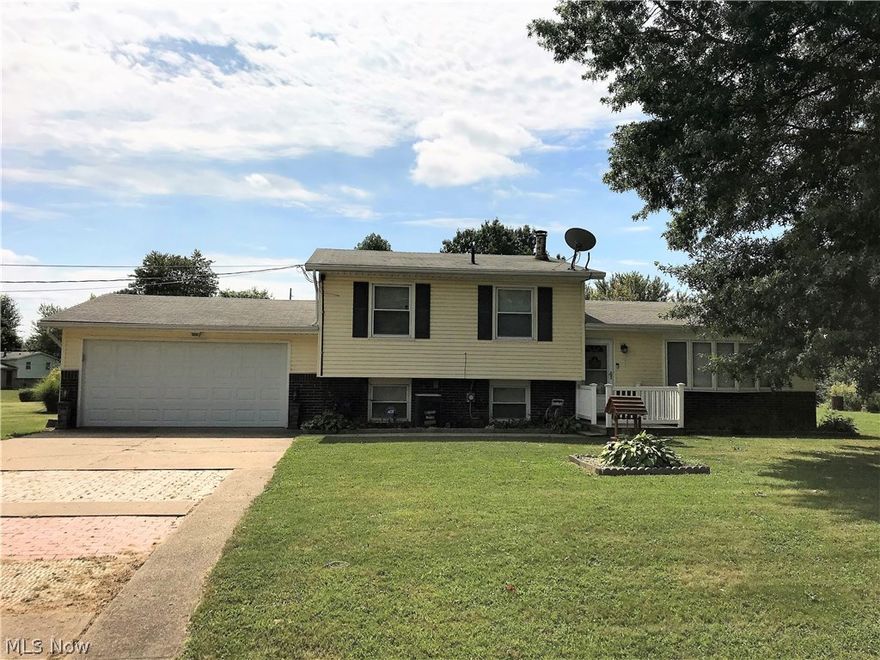 Move right into this completely updated split level sitting on almost half an acre in Canton Township! Step into the foyer entry and make your way to the spacious living room, featuring a brick electric fireplace and large bay window. Connected dining area overlooks patio and fenced in portion of yard through updated sliding doors. Kitchen features new counter tops, modern back splash and stainless steel appliances (2016) as well as convenient breakfast bar. Master bedroom, complete with custom sliding barn door, two additional bedrooms and totally remodeled full bath round out the second level. Enjoy watching football this fall in the lower level family room - unique rustic paneling makes the room extra cozy. Large utility room and two car garage are both accessed from lower level. Laminate flooring, carpet, windows, light fixtures, exterior doors, water heater and electrical panel all updated in 2016. Property is in the Canton Local School District featuring brand new high school and