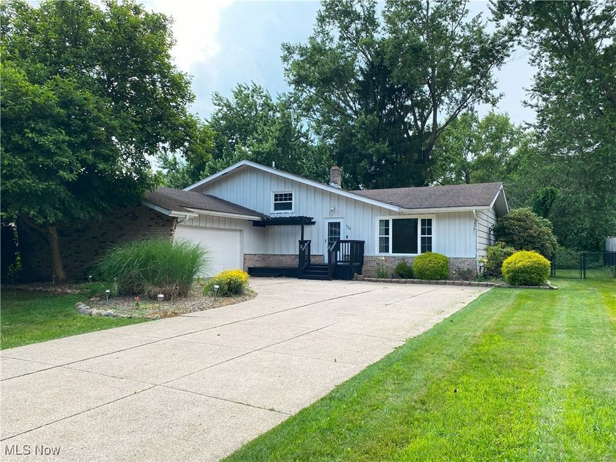 Welcome to this charming split-level home nestled in the heart of Munroe Falls! From the moment you arrive, you’ll be impressed by the great curb appeal! Step inside to find vaulted ceilings in the living room and kitchen, creating a bright and airy space filled with natural light—perfect for everyday living and entertaining. This home offers 3 comfortable bedrooms, with the potential for a fourth, making it ideal for growing families or a home office setup. You'll also enjoy 2 full bathrooms and a finished lower level featuring a built-in bar—great for hosting gatherings or relaxing after a long day. Step out onto the deck overlooking the backyard, a perfect spot for summer BBQs or peaceful morning coffee. Located in a quiet, friendly neighborhood with easy access to local parks, schools, and amenities, this home is a wonderful opportunity to enjoy comfort, space, and style in Munroe Falls.