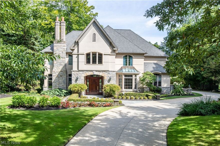 This classic home built and designed by the owner is beyond spectacular.   Every square inch exudes perfection.  Walk into the gracious large foyer which sets the stage for the visit.  The open floor plan offers beautiful lst floor rooms, including a great room with fireplace, wall of windows which open up to a wonderful stone patio.  The kitchen with a delightful seating area (also overlooking the very private backyard) is complete with granite countertops, a 6 burner Viking cooktop, GE Profile side x side refrigerator and a Bosch dishwasher plus hardwood floors and opens to the patio.  The elegant dining room has bowed windows and has an adjoining butler's pantry.  The spacious library/family room offers a fireplace, custom built ins and a door which opens to a Juliet balcony.  There is a lst floor bedroom/study as well as a powder room.  The master bedroom suite with a  tray ceiling and extraordinary moldings, bath with marble floors, views of  the ultra private backyard, soaking tu