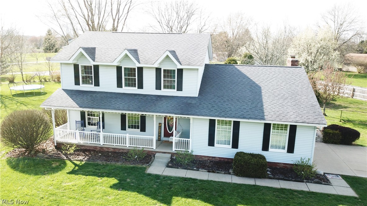Welcome to 601 Oakhaven Drive in Mogadore! This gorgeous Colonial home has 3 bedrooms and 2.5 bathrooms. A covered front porch offers a wonderful place to relax outside. Walk inside to see new flooring in the spacious living room and dining room. The eat-in kitchen has stainless steel appliances and an abundance of cabinet and counter space. Sliding glass doors lead from the kitchen to the large deck overlooking the huge backyard. Family room with a brick fireplace and skylights is located off the kitchen as well. First-floor has convenient half bathroom. Head upstairs to find three large bedrooms and two full bathrooms. The Master bedroom has high slanted ceilings and two skylights. Master bathroom is updated with gorgeous tile flooring, paint, lighting fixtures and vanity. The bathroom has a skylight letting a ton of natural light to flow in. The partially finished basement with new flooring offers so much bonus space! Laundry is located in basement as well. Convenient two-car attach