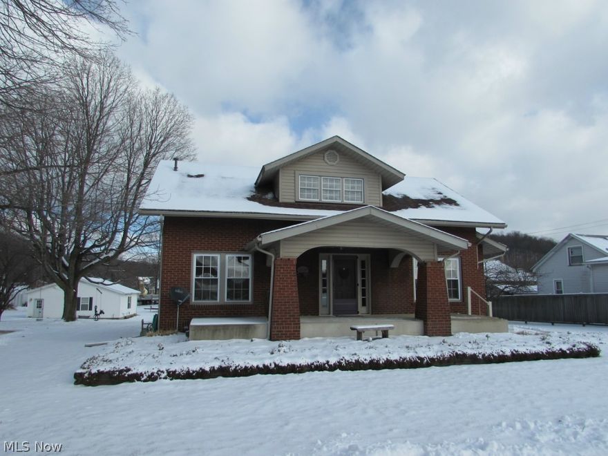 Here is a charming and most welcoming brick home. The large Living room offers hardwood flooring, a cozy gas fireplace and built in shelving. You will appreciate the Dining area with oak built in Hutch, window seat with storage below & the glass French doors. Newer replacement windows, siding, roof, furnace, A/C, wiring & privacy fencing. Large back yard with patio area-alley in back. Exclude bedroom curtains. Furnace recently checked by DNP Htg (wiring has been updated but knob & tube is in upstairs on walls. Floor receptacles have updated wiring).  Easy access to highway.