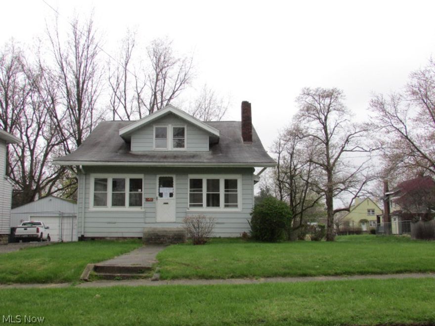 Large colonial with tons of potential.  Gorgeous woodwork and floors throughout. Spacious kitchen w/nook  DR, LR w/FP, lots of natual woodwork.  Situated on large corner lot.  Detached two+ car garage.  Property is sold AS IS.  Equal Housing Opportunity.  FHA uninsurable.