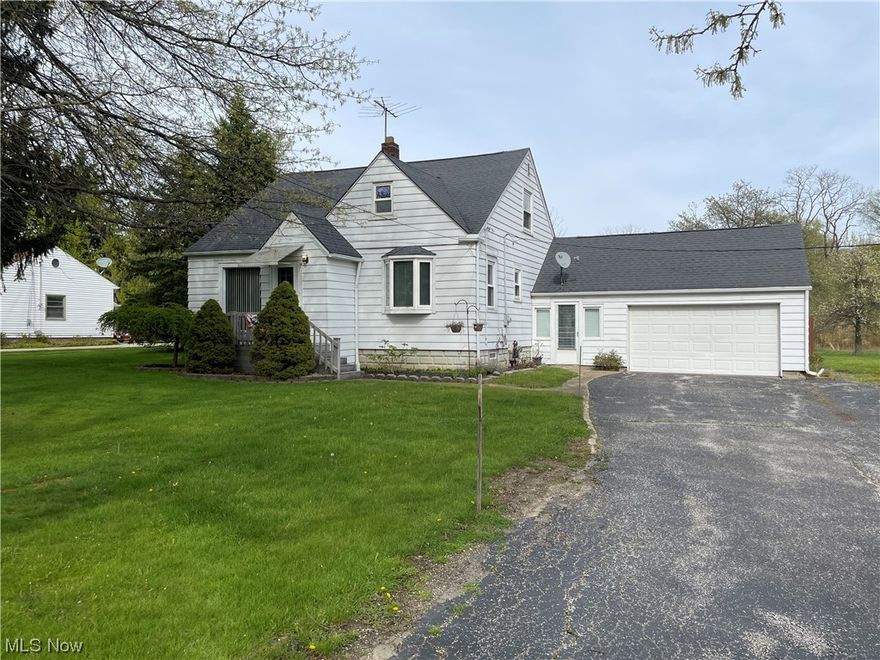 What a tremendous opportunity to either expand on this home or even build a new home on this 2.68 acre parcel in Solon. There is a small cape cod on the property that was updated about 25 years ago where they created a master suite on the first floor including large bathroom and walk-in closet. The entryway between the house and the garage was turned into a 4-season patio and a deck was also added off of the master bedroom. The second floor has a full bath and lots of room. But the wow factor is this amazing piece of land with a large pond and wooded area in the back of the lot. What opportunities this property has. There is also electric that goes all the way back. The home is also Public sewer and water. Must See!