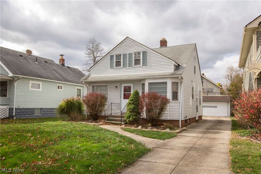 Prepare to be Moved!...into this charming bungalow in western Lakewood.  Step up to the cheery front door into the bright living room with large picture window, ceiling fan and brand new carpet.  An arched doorway leads off to the right of the entrance to the dining room with stylish bay window.  Clean, white cabinetry and appliances keep the kitchen feeling light and bright and easy-care ceramic tile floor complements both the kitchen and dining room.  Doorways from the living room and kitchen lead to the two hardwood-floored bedrooms and full bath with large, glass-block window offering privacy as well as natural light.  The second floor features a spacious Master bedroom with new carpet, side and front-facing dormer windows and a flexible, open floor plan.  Newer refrigerator/stove and washer/dryer all stay.  Detached 2-car garage and partially fenced yard, perfect for a dog run.  Desirable location convenient to freeway access, Metroparks and all the best that Lakewood has to offer