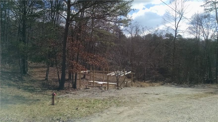 Rolling wooded land with about about 3200 foot of frontage on Little Hocking river and over 700 foot of frontage on west branch of little hocking, about 1/4 mile frontage on Schoolhouse road.No mineral rights. No utilities on property. AEP & Little Hocking water @ road. Will need to check with each to see if service is available.Seller will consider carrying 2nd mortgage to cover down payment.