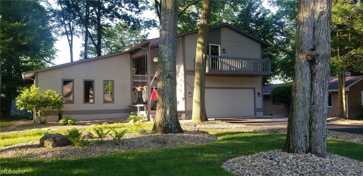Stunning! Custom built, one of a kind contemporary 2 story! Uniquely designed it has architectural flare that you will love! You won’t want to miss out on this one owner home that has been well maintained. Larger than it looks, you will step into a large inviting 2 story foyer entrance that offers views all around you! The beautiful living room w/vaulted ceiling opens up into the formal din rm. The kitchen overlooks the eating area and leads you into the cozy family rm w/frpl. The views to the back yard are incredible! There are sliding glass doors from the eating area & fm rm to the deck area. The 2nd floor offers 3 bdrms, 2 full baths, an incredible master suite w/private balcony, walk in closet and a sitting area that overlooks the foyer! The lower level has a finished rec rm, full bath, office and wet bar providing great space for entertaining! The back yard is unbelievable! Huge tiered deck, large tiered patio areas, screened in gazebo overlooking a park like private s