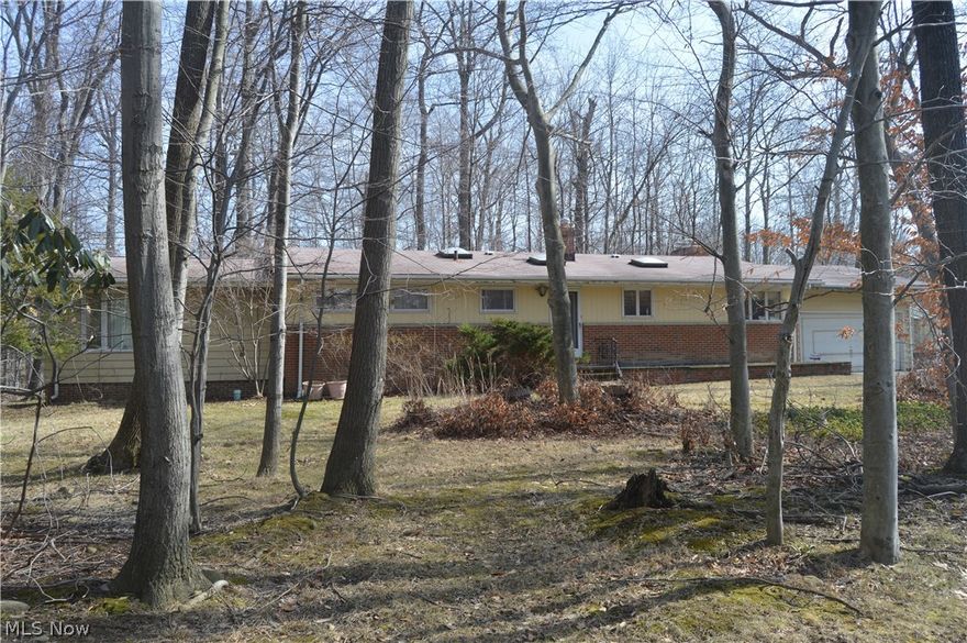 Home In The Desirable Village of Woodmere, This 3 Bedroom 2 Full bath home is The Orange School District Boasts Plenty of open space, large bedrooms, Skylights, Vaulted Ceilings, 2 Fireplaces, Kitchen with eating area, 2 Car Attached Garage, with a greenhouse attached, and a fully wooded lot. Full Basement that is partially finished with a woodburning Fireplace 2 Parcels For Sale, 1 with the House, and the other Vacant, being listed together, However, Seller open to Selling Parcels Separately.