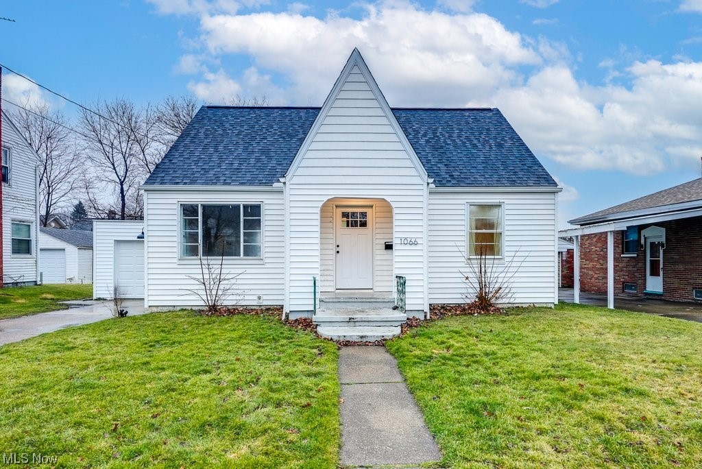 Welcome to 1066 Dayton St. in North Hill, Akron. Are you looking for a starter home or an investment property? This 3 bedroom 2 bath home has many great features! Hardwood floors throughout the home. Fresh paint throughout the home and Updated Eat-in Kitchen. Full Bathroom on the first floor updated 2021. Full basement with additional bathroom! NEW ROOF 2021 and many of the windows were replaced in 2021. 1 car garage. All appliances stay with the home. For the Buyer's peace of mind, the Sellers have included a one year Home Warranty. Property is being Sold As-Is.