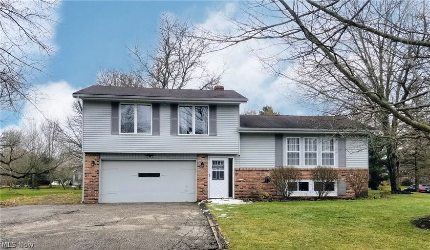 Wonderful split level with an open floor plan, located in an area of more expensive homes. This property is situated on a large lot with deck, patio and newer fenced in garden area. The finished walkout basement (potential in law suite) adds more living space with newly added bathroom, tiled recreation room/possible 4th bedroom, and office area. Pretty porcelain tile entry just a few steps up to the main living area which includes a large living room with shelving, newer picture window and hardwood flooring.  The large eat in kitchen has lots of cabinet and counterspace with granite countertops, newer appliances 2019, backsplash, beautiful lighting and porcelain tile flooring. The oversized family room has gas or wood burning fireplace, hardwood flooring and built in shelving with striking barn doors (2015) On the second floor are 3 nice sized bedroom with hardwood flooring and a totally remodeled full bathroom. Interior paint in 2020 and exterior aluminum painted in 2020. Powder room