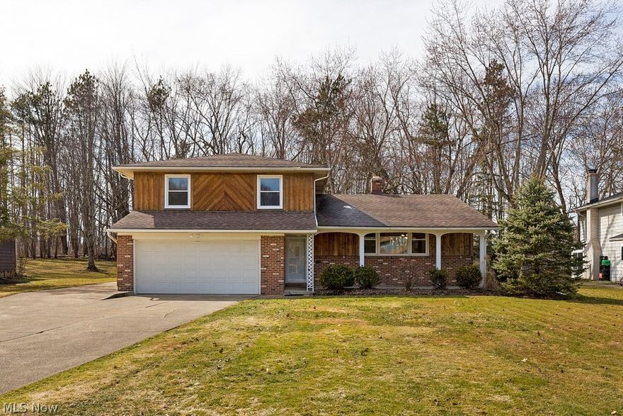 Welcome home to this move-in-ready, beautifully updated split in the Solon School District! Kitchen & baths have been recently renovated, walls freshly painted and beautiful vinyl plank floors throughout the main level. Newer windows throughout. From the spacious foyer you’ll see the vaulted & beamed ceiling in the living room & spacious formal dining room. Kitchen features new cabinetry, granite counters, stainless appliances & overlooks the family room. Sunroom with patio access & convenient storage room is off the family room. A small room adjoins family room that can be used as a study nook or converted to main floor laundry (hookups are present). Powder room access from family room or directly from garage! Upstairs are 3 sunny bedrooms (all with hardwood floors), hall bath with stone vanity, and large primary suite featuring a shower bath, solid-surface vanity, double closets and crawlspace for additional storage. Lower level boasts a rec room with built-ins, a kitchenette, abunda