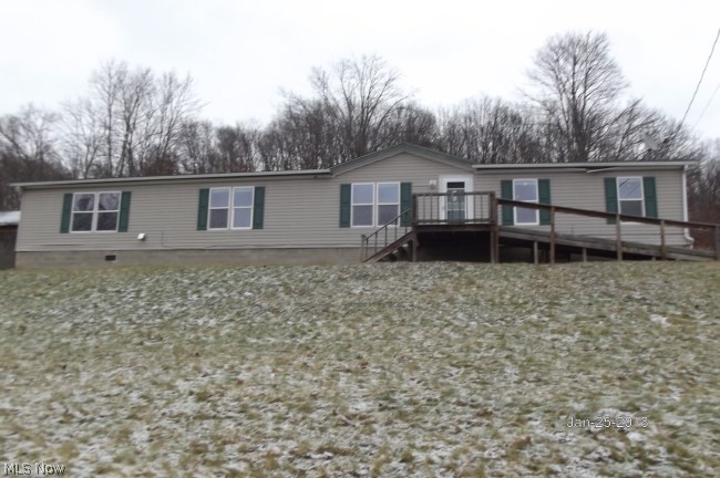 Large Modular on 3.38 acres. Open floor plan, large rooms 4 miles outside of Carrollton and Dellroy. Fireplace on living room open to kitchen. Master Bedroom with walk in closet and bath with double vanity, garden tub. first floor laundry.