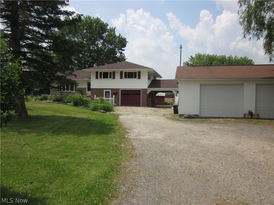 Remodeled split level newer updated kitchen.  Hardwood floors some newer carpeting.  Huge breezeway, outside riding arena - horse barn with 5 stalls,  pond, newer detached 3 car garage  plus one car attached garage and carport, inground pool perfect for outside entertaining.