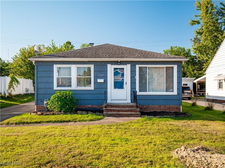 Step inside this beautifully maintained 1950s ranch where character meets thoughtful updates. The updated kitchen features wood cabinetry, granite counters, a tile backsplash, stainless steel appliances, and refreshed lighting, opening into the dining area and living room for a bright, open feel. Hardwood floors, coved ceilings, and replacement windows add timeless appeal. Three bedrooms and a modernized full bath complete the main level. The lower level nearly doubles the living space and includes a spacious family room with glass block windows, a bonus room that could serve as a bedroom or office, a storage room, and a second updated full bath. Outside, enjoy a cement driveway, a two-car garage with a clean, drywalled interior for storage or gatherings, a manageable yard, and a backyard patio with awning and roller shade. Recent updates include a new hot water tank (2025), furnace (2022), central air conditioning (2020), and updated lighting in key living spaces. This move-in ready home offers quality improvements inside and out. The home sits in a convenient location near parks, shopping, dining, schools, and highway access. Call your Favorite Realtor to show you this home!
