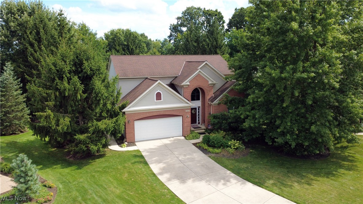Discover this beautifully maintained 4-bedroom, 2 full bath, 2 half bath home in the highly sought-after Ethan’s Green community of Twinsburg. Tucked away on a private cul-de-sac, this property offers 2,974 sq. ft. of living space and is move-in ready.
Enter through the welcoming front foyer, where you’ll find a convenient office just off the entry. The first floor features a bright living room, formal dining room, and a spacious kitchen with sliders opening to the deck and serene park-like backyard. A cozy family room with fireplace and a convenient half bath complete the main level. Upstairs, the primary suite includes a private bath with a soaking tub, separate shower, water closet, and a large walk-in closet. Three additional bedrooms are generously sized and share a full bath with dual sinks and a skylight. For added convenience, laundry is already plumbed in the second walk-in closet upstairs, making the option for second-floor laundry a breeze. A full basement provides excellent storage and endless possibilities for additional living space. Lovingly cared for over the years, this home combines space, comfort, and location—ready to welcome its new owners.