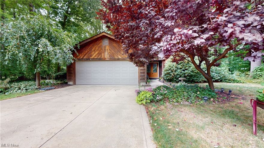 Secluded Bi-level home on a beautiful wooded culdesac .66 lot.  Main floor offers Great Room with wood burning fire place open to the kitchen , SS appliances, Jenn-Air stove.  Dining room with sliding doors opens to a screened  sun room, with attached deck.  Master bedroom has sliding doors to sun room.  Large dressing area with 2 walk-in closets.  Lower level has family room with wood burning stove, office, bathroom and 2 bedrooms, utility room with washer/dryer  and water conditioner that stay with the home.