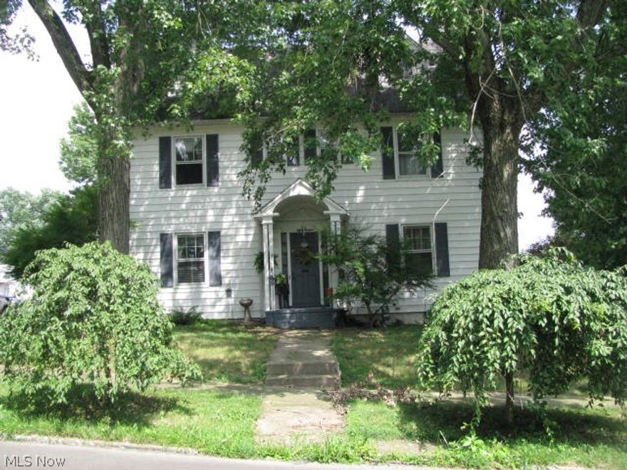 Great location, exceptional curb appeal, and only 2 blocks from the City Park! Loaded with charm and character. 4 fireplaces (1 with marble, 1 has gas logs), crown moldings, and lots of built-ins for an abundance of storage! Spacious living and dining rooms, inviting sun porch makes ideal family room and opens to a wrap-around deck and patio. 1st fl laundry/mud room with lots of cabinets. Third floor has 2 bedrooms and 1 bathroom - could be play and craft rooms. Double corner lot, vinyl-fenced backyard, and detached 2-car garage. Basement has bomb shelter. MWCD Assessment is $6.00 annually.