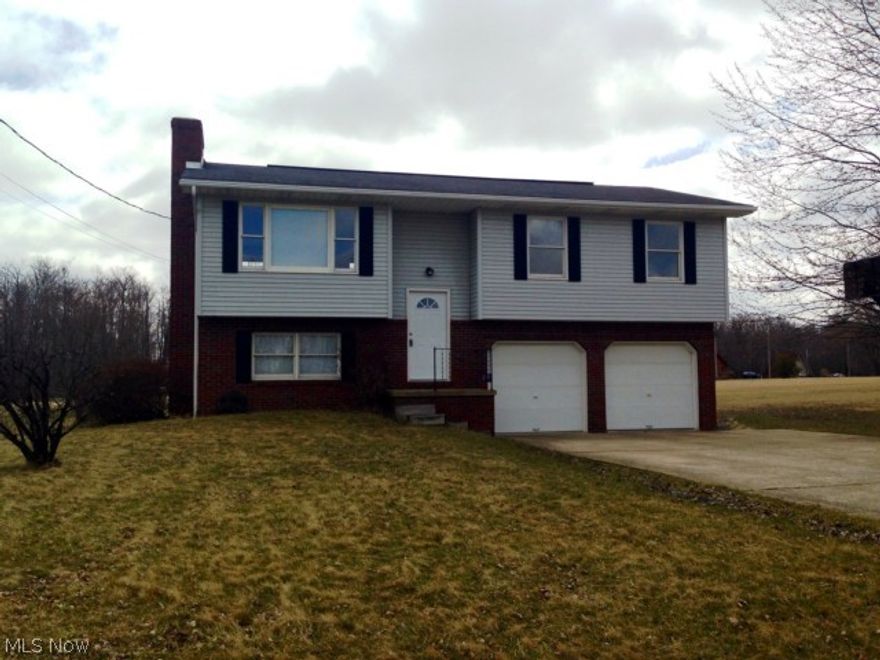 Our place! is what you'll be saying when you see this raised ranch home in Cinnamon Lake Community. The upstairs offers an open floor plan with new carpet throughout, new kitchen counters and a 12x20 deck. The lower level offers a large family room with a wood burning fireplace. This space is great for entertaining or just hanging out.