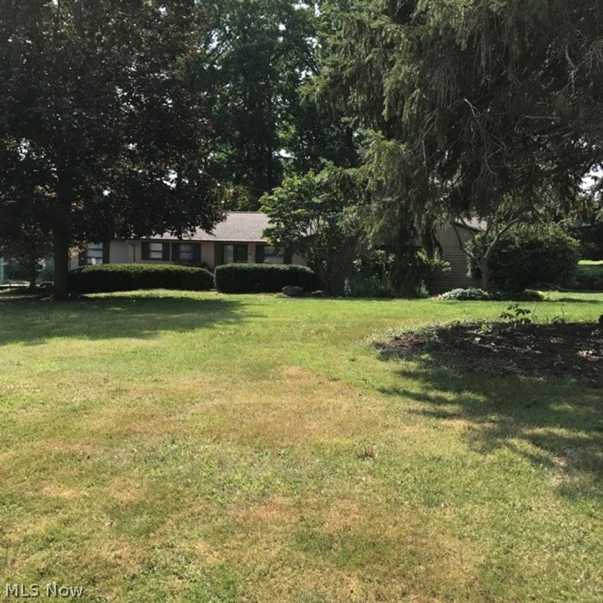 Stunning contemporary ranch in Howland School district. The rooms are spacious & the kitchen is a dream! the built-ins & mirrors in this home are amazing - you will never run out of drawers, cupboards or closets. Huge walk-in closet in exceptional master bedroom suite & wait until you see the master bath - luxurious! Cathedral ceilings in office & master bedroom. Basement has been totally redone. The rec room features the 2nd fireplace for those chilly evenings. Many newer windows, storm doors, furnace & hot water tank, garage doors, motor, Gilmore's landscaping (2016), exterior & interior of home painted, newer insulation, new brick entrance to front door & security system wired in. Beautiful back yard with wonderful shade trees & it overlooks Trumbull Country golf course. Added bonus is that all appliances stay with the home. This home is exceptional!