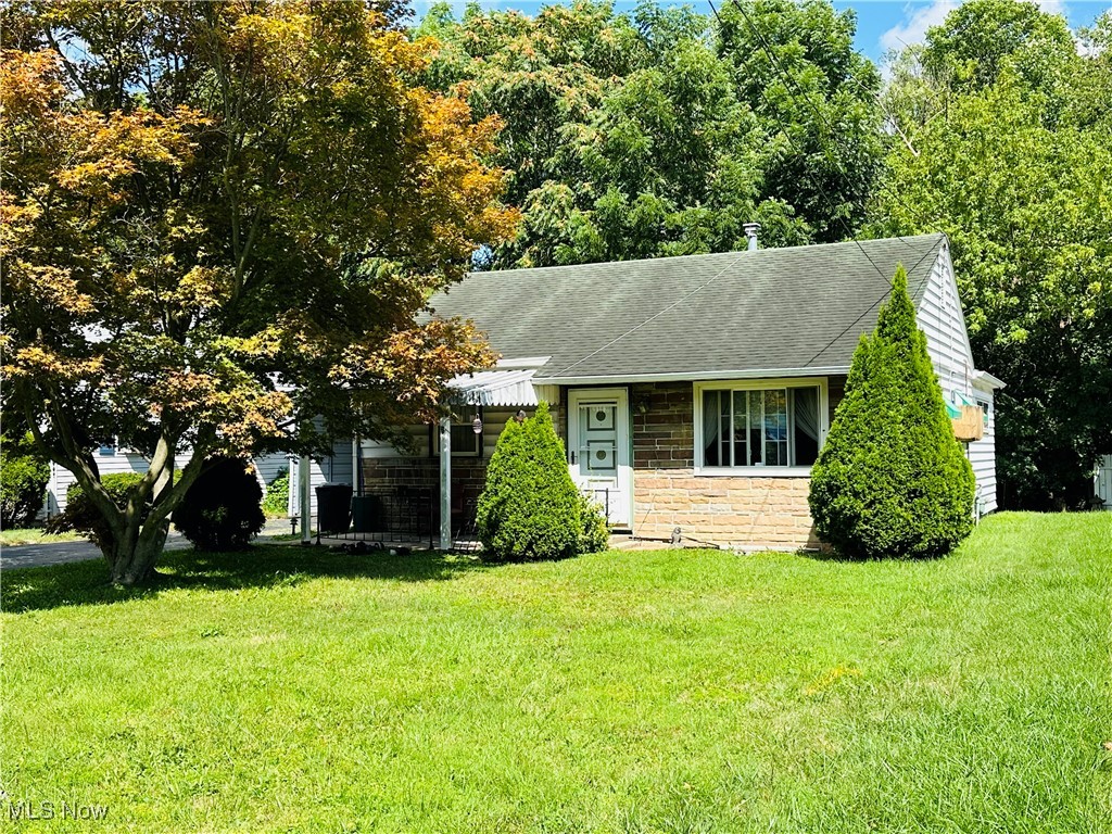Looking for a 2 bed(possible 3 bed)ranch under $100k in Austintown but can’t find anything?! Look no further than 155 N. Navarre Ave! Put in some carpet, lights, and fresh paint and have some instant equity! Bonus: the potential third bedroom could be in the rear addition where the huge dining room currently is where a wall could simply be installed and you would STILL have a small space for your families eating/dining area! This third bedroom definitely adds more value to this cute slab home giving you more possibilities at a great value! There’s an additional three season room in the back that is great for pets, your family get-togethers, or birthday parties for your kiddos! Your decent sized backyard could be fenced in pretty easily for even more privacy! You have an additional carport in front of the garage which gives you lots of extra parking and Dad has an additional room that was added to the rear of the garage for lawn mowers, kids toys, tools, or his very own private, heated workshop that he’s always wanted! Your workshop has an additional entrance door to the backyard for easy access from anywhere on the property! Located on a super quiet street w/Austintown Schools...Put your own personal touches on this hidden gem and make it your own! You better get here and see this beauty before it’s gone!