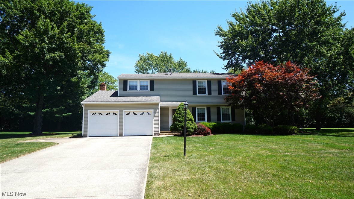 Excellent opportunity, just a short drive from Historic Downtown Hudson in the Hudson City School District! Set in a mature neighborhood with large trees, spacious yards, close to bike and hike trails, and centrally located near a robust interstate system leading to both Cleveland and Akron areas, this nicely appointed 4 bedroom, 2 ½ bath colonial lives so much larger than its stated 2,058 sq. ft. As you approach the house, lovely curb appeal and a quaint covered front porch welcome you to your new home. Upon entry, you’ll notice a sizable living room conveniently positioned between a well planned Eat-in Kitchen and a substantial formal Dining Room. Kitchen was updated in 2014 with new cabinets, solid surface countertops and LVT flooring. Amenities in the Kitchen include stainless steel appliances, dishwasher replaced in ’23, an undermount stainless steel sink with designer stainless faucet, and a peninsula with double sided storage. This deft open floor plan continues beyond the kitchen into two open spaces that provide you with the ultimate design flexibility. Furnished separately, imagine a relaxed Hearth Room where you cozy up by the fire set next to a generous Family Room perfect for entertaining guests. Or, you could combine the two rooms into a massive Great Room for your ultimate gatherings. The Family Room provides sliding door access to the back deck; perfect for outdoor get togethers. Rounding out the main level, is a well-situated ½ bath. Upstairs, 4 bedrooms, including an ample Primary Suite, will meet almost everyone’s needs. The ample Primary Bedroom’s en suite Bathroom has a walk-in shower stall and single vanity. A useful second bath has another single vanity along with a shower/tub combo. And don’t worry about storage, as closet space is in no short supply on the 2nd level and the unfinished basement is perfect for storage or is ready to be finished for additional living space. Contact your favorite realtor to schedule your showing today!