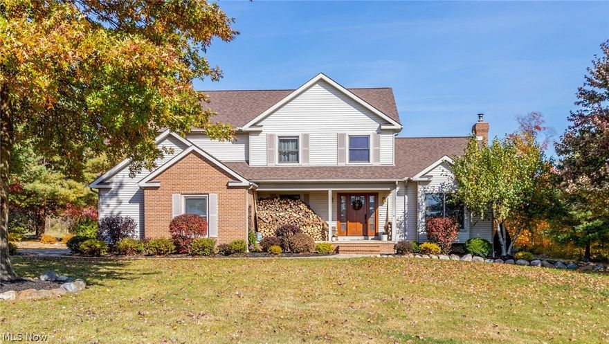 Stunning 4 bedroom, 2.5 bath American Craftsman Style Colonial on 2 .5 lush acres in Hiram. Sellers have invested in workmanship and materials to bring this home to a perfect combination of architectural detail and modern convenience. Newer (2014) hardwood added to refinished existing flooring throughout the main level. Vaulted and beamed living room centers around wood burning stove that provides heat. Open floor plan dining room leads into the Chef's kitchen with dining area, center island and hi-end Kitchen Aid appliances. Custom cabinets made from quarter sawn Oak offer lots of storage, granite counters, and hardwood floors. Convenient powder room and laundry off back hall to 2+ car garage with new (2022) epoxy floor. Oversized Master suite upstairs with vaulted and beamed ceiling. Spa bath with Limestone tile double stall shower with custom glass door, soaking tub and dual vanity with vessel sinks. Three additional spacious bedrooms have new (2022) carpet and share an updated hall