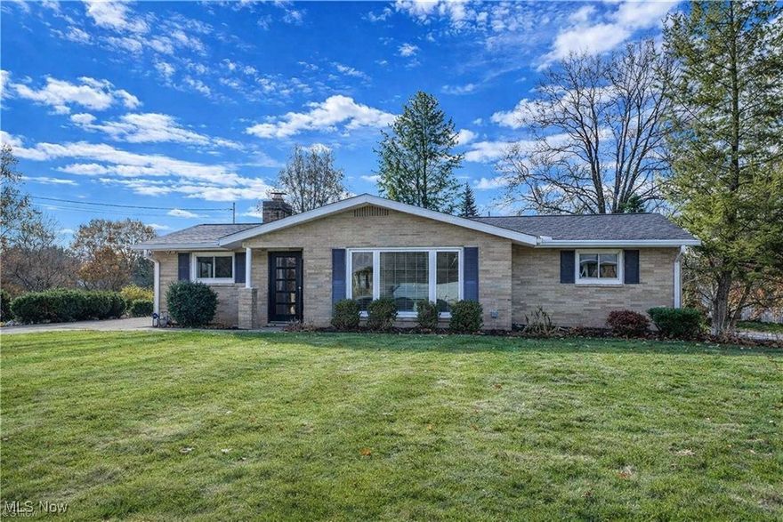 Beautifully renovated raised ranch where quality craftsmanship and thoughtful design show in every detail. Updated top-to-bottom by a respected local custom builder for long-term personal use (not a flip), this 3-bedroom, 1.5-bath home features over $100,000 in high-quality improvements that create truly turnkey living. The stunning kitchen was completely gutted to the studs and rebuilt with new wiring, plumbing, insulation, drywall, quartz countertops, a center island, LG appliances, vented hood, rollout drawers, recessed lighting, and boxed ceiling beams. A reconfigured foyer and stairway open the flow into the dining area and family room, where a gas-ready fireplace and access to the deck and patio make indoor/outdoor living effortless. Both bathrooms were fully renovated with new flooring, vanities, lighting, hardware, and fans vented to the exterior. The redesigned main bath now includes a larger double-sink vanity, expanded tile work, and removal of the old hall-to-bedroom door for better layout and furniture placement. Bedrooms feature new carpet and ceiling fans, while all flooring, lighting, outlets, woodwork, and paint have been updated throughout the home. The lower level offers a spacious rec room with walkout access to the backyard, an updated laundry/utility area, and a rear-entry oversized 2-car garage with new insulation, lighting, and added storage. Major home updates include AC (2024), roof (2024), Renewal by Andersen patio door and dining window, and more. A rare opportunity to own a thoughtfully reimagined home with exceptional craftsmanship and extensive upgrades—nothing to do but move in and enjoy.