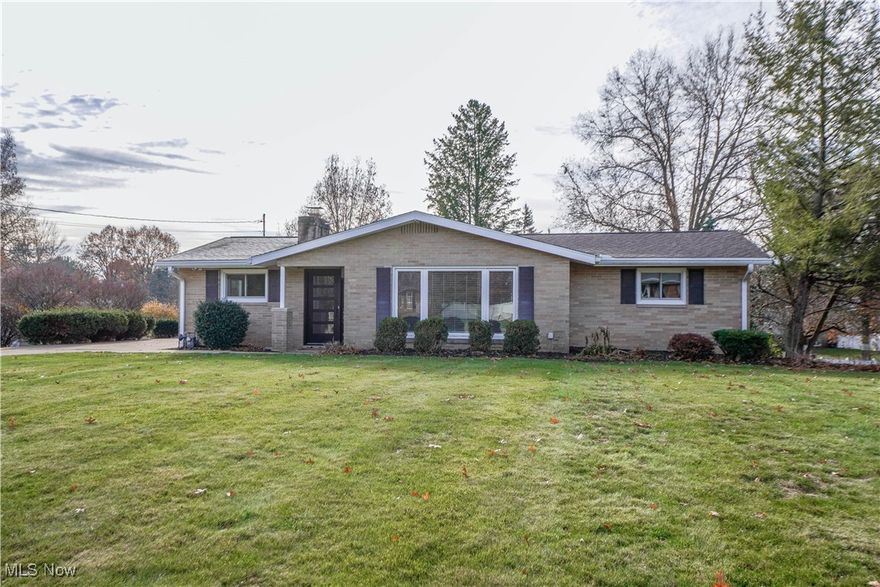 Beautifully renovated raised ranch where quality craftsmanship and thoughtful design show in every detail. Updated top-to-bottom by a respected local custom builder for long-term personal use (not a flip), this 3-bedroom, 1.5-bath home features over $100,000 in high-quality improvements that create truly turnkey living. The stunning kitchen was completely gutted to the studs and rebuilt with new wiring, plumbing, insulation, drywall, quartz countertops, a center island, LG appliances, vented hood, rollout drawers, recessed lighting, and boxed ceiling beams. A reconfigured foyer and stairway open the flow into the dining area and family room, where a gas-ready fireplace and access to the deck and patio make indoor/outdoor living effortless. Both bathrooms were fully renovated with new flooring, vanities, lighting, hardware, and fans vented to the exterior. The redesigned main bath now includes a larger double-sink vanity, expanded tile work, and removal of the old hall-to-bedroom door for better layout and furniture placement. Bedrooms feature new carpet and ceiling fans, while all flooring, lighting, outlets, woodwork, and paint have been updated throughout the home. The lower level offers a spacious rec room with walkout access to the backyard, an updated laundry/utility area, and a rear-entry oversized 2-car garage with new insulation, lighting, and added storage. Major home updates include AC (2024), roof (2024), Renewal by Andersen patio door and dining window, and more. A rare opportunity to own a thoughtfully reimagined home with exceptional craftsmanship and extensive upgrades—nothing to do but move in and enjoy.