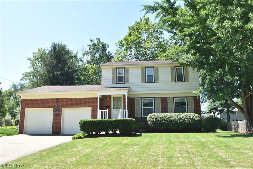 Immaculate, truly  move-in ready colonial.  Furnace, AC, hot water tank and roof (30 yr. architectural shingles) done in 2012.  On the exterior, you'll enjoy a new concrete front porch, steps, walkway, and vinyl railing, adding to the great curb appeal.  Beautiful exposed hardwoods grace the interior throughout, except for newer carpeting in the family room.  Lots of extra storage is yours with double closets in the family room, along with a sliding door to the outdoor patio.  A fireplace with gas logs and brick hearth adds character to this light-filled gathering room.  A spacious eat-in kitchen, along with a formal dining room, provide plenty of room for entertaining.  Some additional features include newer replacement windows, basement glass block windows, completely remodeled large main bath (2016), ceramic floors in the kitchen and baths, new distinctive ceiling fans, and a handy storage shed out back.  This is a well maintained, lovely home.  Pride of ownership shows in every cor