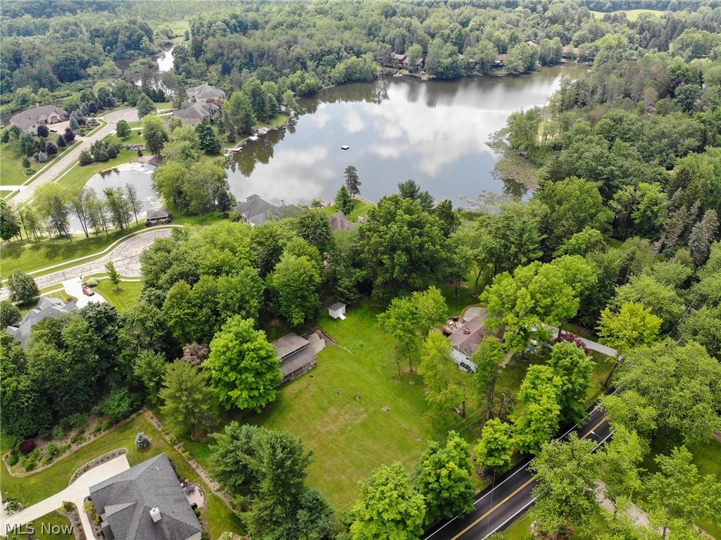Beautiful lot to build your dream home on in the highly sought after Twin Lakes area abutting the Lake Royale Development! This lot is more than 3/4s of an acre w) plenty of area to build your home! Also has HUGE bonus....large outbuilding w/ wood siding, 59 year Elk Shingles new in 2009, Windows @ top for natural sun light, porch overhang w/ concrete floor & sliding doors! This is the outbuilding many of us wish we could have! Plenty of room for storage, workshop, hobby room, woodworking, etc, Dream big, many uses! There is already a foundation of rocks for a driveway from the road with a culvert under the drive area. There is currently a home next door for sale by a different owner at the corner of Diagonal Rd and Lake Royale Blvd that you can purchase and buy this lot to make a LARGE backyard space with outbuilding. Call Lesa today for an onsite tour of the gorgeous lot and the building as well! Don't miss this opportunity to have an awesome lot to build, call today! This area is