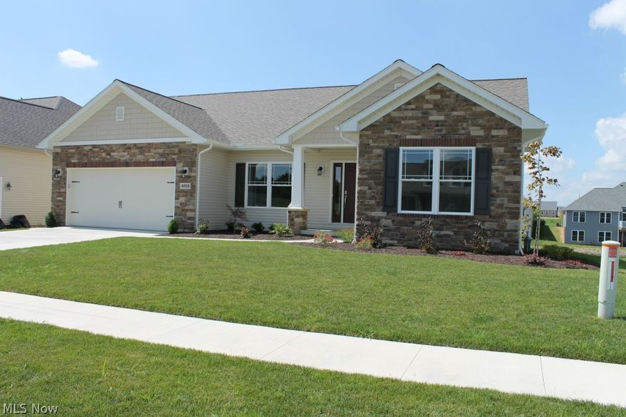 Here is the 2014 Parade of Homes model built by Capstone Homes located in The Reserves of Deer Creek. This home features 2376 sq. ft. of finished living space. The main floor features an open floor plan, 9’ ceilings throughout, a coffered ceiling in the large master bedroom and a 5’ shower in the master bath. The bright great room features a wide bank of windows overlooking the lake and is open to the dining room and custom kitchen with pantry.  A laundry room/mud room is directly inside off the 2 car garage. The walk out lower level of this home, complete with 14 course block, is finished with a family room and stone fireplace, a third bedroom, a third full bath, wet bar plus plenty of storage area. You won’t want to miss this beautiful custom built new home just waiting for new owners.